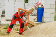 © Voyagerix - Woman using shovel on constriction site