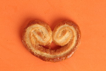 Puff pastry cookies on colorful background