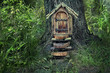 © Ju_see - fairytale forest house. Little wooden fairy door in tree trunk. tree house in woodland setting, pixie or elf home. rustic wooden door built into foot of tree trunk in woods. soft selective focus
