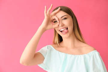 Poster - Funny young woman on color background