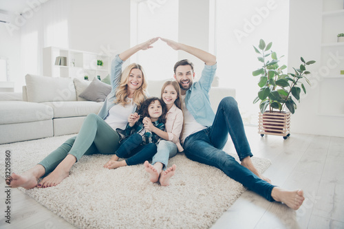 Cuadros en Lienzo Photo of four people foster family moving new apartments making arms roof promis