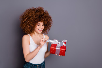 Poster - Close up photo of pretty lady big giftbox hands ecstatic open curious what inside wear white tank-top isolated grey background