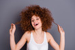 © deagreez - Closeup photo of volume hairdo lady natural hair color perming play cool curls wear white tank-top isolated grey background
