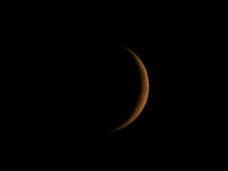 Wall Mural - waxing crescent moon seen with telescope