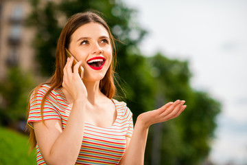 Poster - Portrait of charming lady with foxy ginger haircut using modern technology speaking outdoors