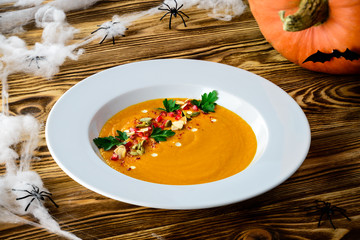 Sticker - Delicious pumpkin soup with heavy cream Top view. Space for text