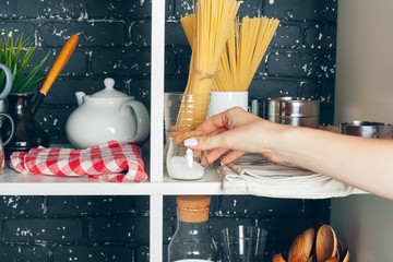 White shelving unit with set of dishware