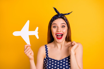 Sticker - Close-up portrait of her she nice attractive lovely glad positive cheerful cheery straight-haired girl holding in hand white plane black friday sale isolated over bright vivid shine yellow background