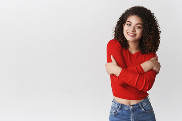 Wall Mural - Charming young smiling friendly-looking lively happy girl feeling little chilly windy evening weather wearing cropped top walking summer night boyfriend date grinning tilting head flirty, hugging