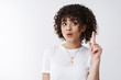 © Cookie Studio - Oh got idea. Girl finally found solution excellent plan raise index finger eureka gesture folding lips look up lift eyebrows have perfect suggestion creative female coworker share thoughts