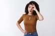 © Cookie Studio - Oh amusing. Curious fascinated good-looking cute young european curly hair girl folding lips wow incredible gesture widen eyes excited show okay ok awesome gesture check out amazing cool thing