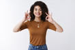 © Cookie Studio - Perfection. Cheerful delighted young bright optimistic girl curly dark hair stylish outfit show okay ok confirm gesture smiling broadly satisfied gladly approve good concept, white background