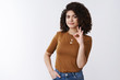 © Cookie Studio - Well okay. Serious-looking confident young female entrepreneur agrees terms look doubtful take decision give approval show ok fine good gesture encourage friend see efforts, white background