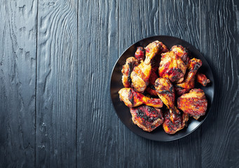 Wall Mural - Spicy Grilled Jerk Chicken on a plate