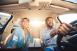 © Prostock-studio - Enjoying travel. Excited african couple driving car