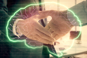 Double exposure of brain drawing on office background with two men handshake. Concept of innovation