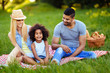 © NDABCREATIVITY - Picture of lovely couple with their daughter having picnic