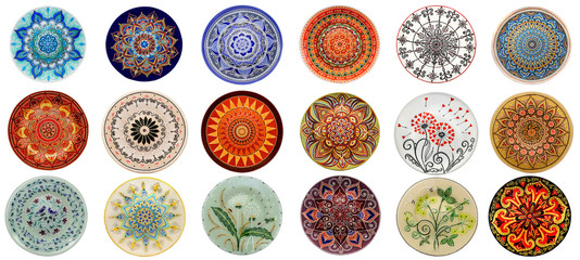 Set of decorative ceramic dishes hand-painted with acrylic paints floral pattern isolated on white background