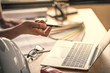 © godshutter - Architect & Engineer working drawing document about project planning and progress of work schedule on the home building construction site