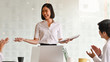 © Prathankarnpap - Encouragement from colleague before Young businesswoman explaining her idea in the meeting room.