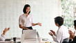 © Prathankarnpap - Young passionate businesswoman explaining her idea in the meeting room