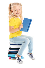 Cute little girl sitting on stack of books against white background