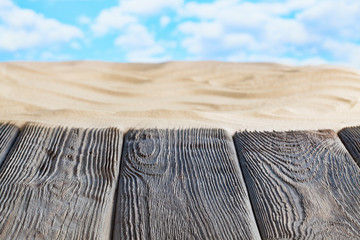 Wall Mural - Old wooden table on summer beach