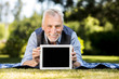 © Freepik - Man laying on a blanket with a tablet mockup