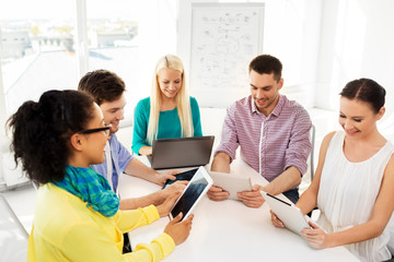 Poster - business, technology and startup concept - happy creative team with table pc computer at office