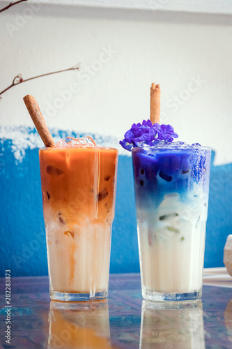 Iced Milk Tea And Erfly Pea Latte With Cinnamon Stick On Iced Milk Tea And Erfly Pea Latte With Cinnamon Stick On