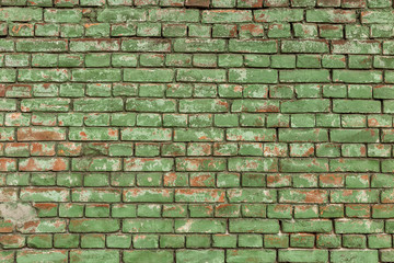 Old green brick wall, rustic texture, design background.