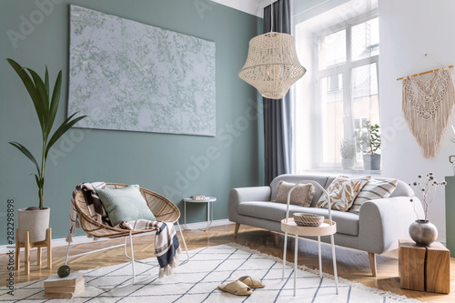 Boho interior design of living room with sofa and rattan armchair Poster Mural XXL
