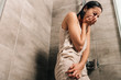 © LIGHTFIELD STUDIOS - lonely sad woman crying in shower at home with copy space