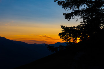 A mountain range during the colorful sunset