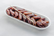 A tray of sweet juicy and delicious dates with fork ready to eat or to add to food preparation 