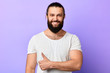 © the faces - cheerful personal trainer showing thumb up to the camera. close up portrait, isolated blue background. studio shot. good job. agreement