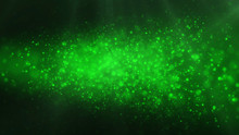 Green Shiny Glowing Glitter Background. Dust, Particles Green Colored On Dark Background. Christmas, Festive, Greeting Pattern.