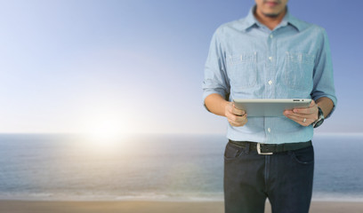 Businessman using digital tablet in hand