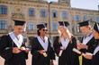 © zinkevych - Cheerful graduating students glad having their diplomas.