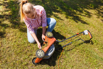 Person having problem with land mower