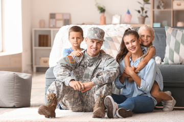 Wall Mural - Happy military man with his family at home