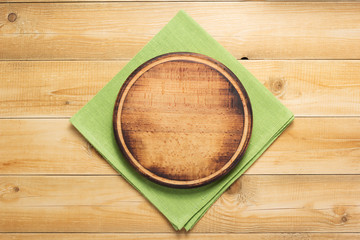 Canvas Print - pizza cutting board and naplin at wooden background