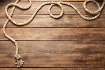 ship rope at wooden board background