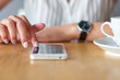© Joe-L - Business woman hands using smart phone and cup of coffee.