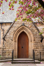 Entrance To Church With Flowering Tree UK