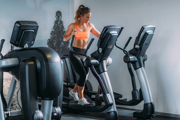 Woman Exercising on Elliptical Cross Trainer