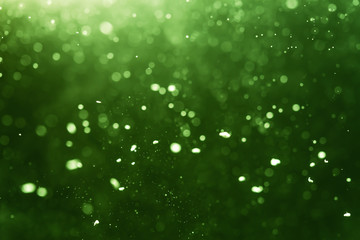 Abstract Green bokeh defocus glitter blur Background.