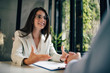 © bnenin - Businesswoman gesturing at a male colleague during a discussion