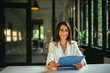 © bnenin - Portrait of a young positive female job applicant holding document