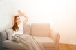 Asian woman relaxed and resting breathing fresh on sofa at home.